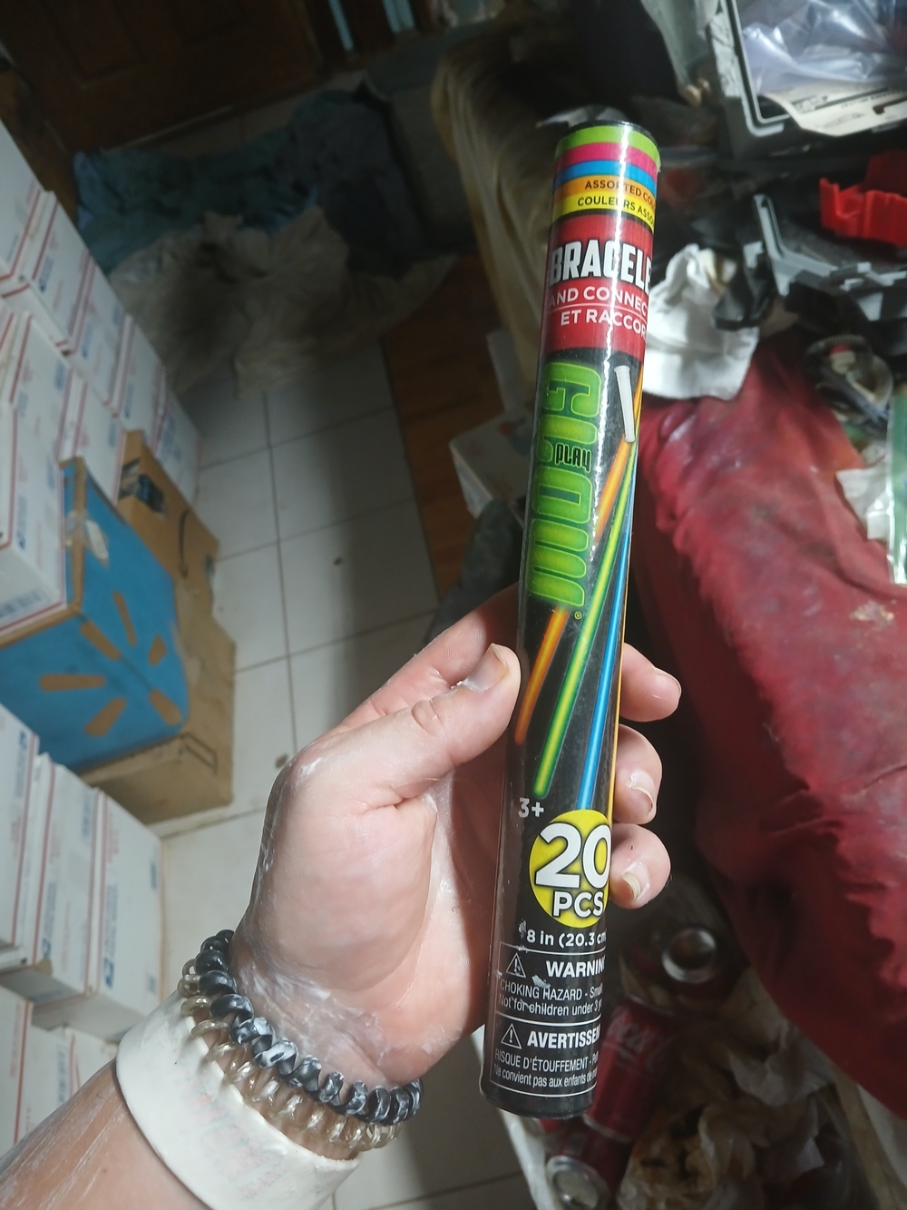 plastic tube holding 20 glow bracelets and connectors